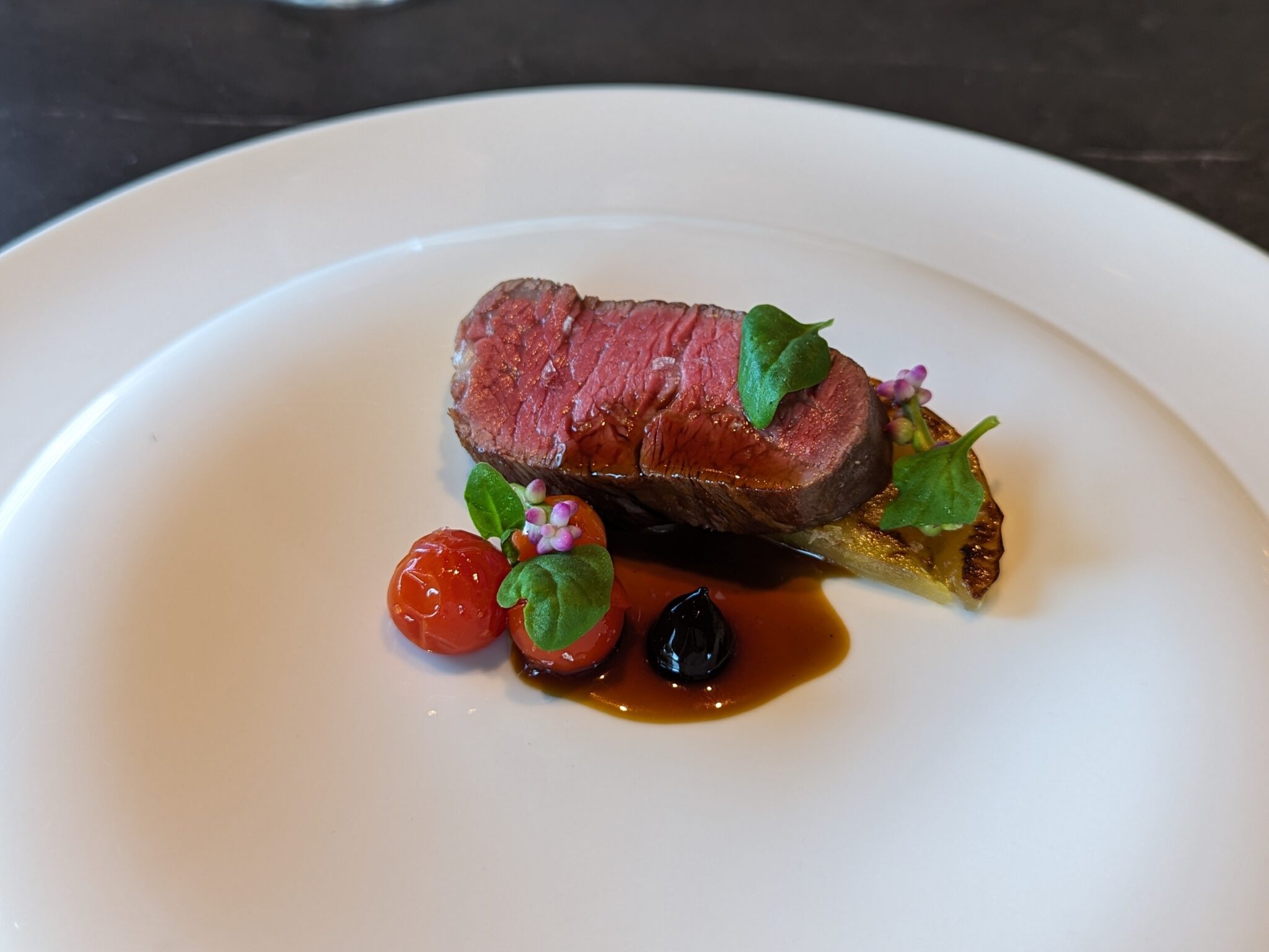 Filet of Beef, Green Tomatoes, Swiss Chard, Smoked Jus at Cyrus